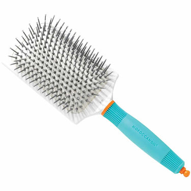The Moroccanoil Ceramic Paddle Brush is a high-quality styling tool designed to provide even heat distribution for faster drying and a shiny finish. With its ceramic and ionic properties, this brush ensures a smooth, sleek look while protecting hair from heat damage